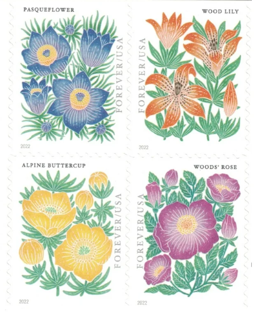 Close-up view of a sheet of The New York Botanical Garden USPS stamps featuring vintage-style paintings of garden flowers like roses and tulips.